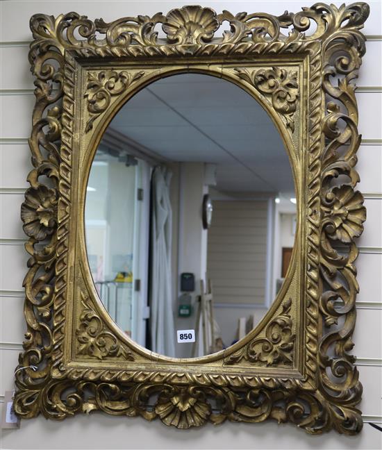 A 19th century Florentine giltwood wall mirror, with oval plate, W.64cm H.78cm